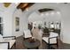 Bright open concept living room with wood floors and elegant arched doorways leading to other parts of the home at 1523 E Treasure Cove Dr, Gilbert, AZ 85234