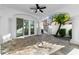 Elegant covered patio featuring tile flooring, a ceiling fan, and seamless access to outdoor spaces at 1523 E Treasure Cove Dr, Gilbert, AZ 85234