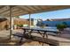 Spacious backyard with a large table and bench seating, perfect for outdoor dining at 1635 W Grovers Ave, Phoenix, AZ 85023