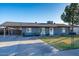 Inviting single-Gathering home with a manicured lawn, a cozy front porch bench, and ample parking at 1635 W Grovers Ave, Phoenix, AZ 85023