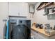 Functional laundry room with modern washer/dryer and ample storage space at 1635 W Grovers Ave, Phoenix, AZ 85023