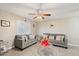 Inviting living room featuring tile floors, neutral walls, and a ceiling fan for comfortable living at 1635 W Grovers Ave, Phoenix, AZ 85023