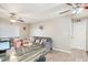 Bright living room with tile flooring, ceiling fans and comfortable seating area at 1635 W Grovers Ave, Phoenix, AZ 85023