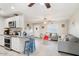 Bright and open living room with a seamless transition into the stylish kitchen, and tile flooring throughout at 1635 W Grovers Ave, Phoenix, AZ 85023