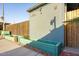 A lovely side yard featuring wood-look planters with rock base and a privacy fence at 1635 W Grovers Ave, Phoenix, AZ 85023