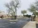 Community entrance with decorative trees and controlled access gates at 1750 W Union Hills Dr # 91, Phoenix, AZ 85027