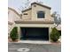 Two-story home featuring an attached garage and mature landscaping at 1750 W Union Hills Dr # 91, Phoenix, AZ 85027