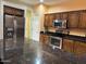 Well-equipped kitchen featuring stainless steel appliances and dark granite countertops at 1750 W Union Hills Dr # 91, Phoenix, AZ 85027