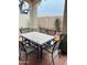 Inviting covered patio with a table and chairs, creating an ideal spot for outdoor dining and relaxation at 1750 W Union Hills Dr # 91, Phoenix, AZ 85027