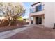 Spacious backyard with a mix of patio and desert landscape at 18268 W Carol Ave, Waddell, AZ 85355