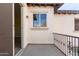 Balcony with railing featuring a view into the interior of the home at 18268 W Carol Ave, Waddell, AZ 85355