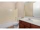 Bathroom features vanity with a large sink and shower with bath tub at 18268 W Carol Ave, Waddell, AZ 85355