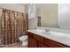 Clean bathroom featuring a classic shower and tub combination and a vanity with sink at 18268 W Carol Ave, Waddell, AZ 85355