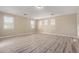 Spacious bedroom with lots of natural light and modern wood flooring at 18268 W Carol Ave, Waddell, AZ 85355