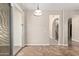 Bright dining area next to sliding glass door and arched entrance to stairway at 18268 W Carol Ave, Waddell, AZ 85355