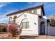 Charming two-story home with balconies, desert landscaping, and a brown two-car garage at 18268 W Carol Ave, Waddell, AZ 85355