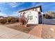 Charming two-story home with balconies, desert landscaping, and a brown two-car garage at 18268 W Carol Ave, Waddell, AZ 85355