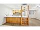 Bright kitchen featuring stainless steel appliances, light wood cabinets, white countertops, and sleek backsplash at 2117 W Pontiac Dr, Phoenix, AZ 85027