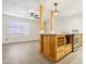 Kitchen island with white countertop, pendant lighting, oven, and adjacent to open living space at 2117 W Pontiac Dr, Phoenix, AZ 85027