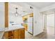 Kitchenette with white countertop, updated tile backsplash and stainless steel appliances at 2117 W Pontiac Dr, Phoenix, AZ 85027