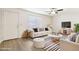 Cozy living room featuring neutral tones, stylish furnishings, and lots of natural light, perfect for relaxation at 2117 W Pontiac Dr, Phoenix, AZ 85027