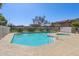 Community swimming pool and hot tub surrounded by a secure white metal fence at 2117 W Pontiac Dr, Phoenix, AZ 85027