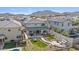 Aerial view of a home featuring a manicured backyard with a artificial turf and patio at 21186 W Hillcrest Blvd, Buckeye, AZ 85396