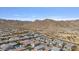 This aerial view showcases the surrounding mountains and neighborhood at 21186 W Hillcrest Blvd, Buckeye, AZ 85396