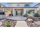 A covered patio with a dining table and native landscaping at 21186 W Hillcrest Blvd, Buckeye, AZ 85396