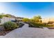 Beautiful backyard with lush landscaping, rock accents, and mountain views at 21186 W Hillcrest Blvd, Buckeye, AZ 85396
