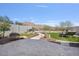 Landscaped backyard featuring artificial turf, desert landscaping, and mountain views at 21186 W Hillcrest Blvd, Buckeye, AZ 85396