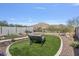 Backyard with mountain views featuring artificial turf and desert landscaping at 21186 W Hillcrest Blvd, Buckeye, AZ 85396