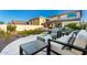 Well-manicured backyard features seating area, artificial lawn, and desert landscaping at 21186 W Hillcrest Blvd, Buckeye, AZ 85396