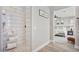 Bright bathroom with a tiled walk-in shower, white subway tile, and gray accent walls with modern fixtures at 21186 W Hillcrest Blvd, Buckeye, AZ 85396