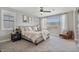 Bright bedroom with ample natural light, neutral walls, and a ceiling fan at 21186 W Hillcrest Blvd, Buckeye, AZ 85396