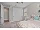 Bedroom with light colored walls, double door closet, light colored furniture, and carpeting at 21186 W Hillcrest Blvd, Buckeye, AZ 85396