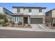 Attractive two-story home featuring a landscaped front yard and a two-car garage at 21186 W Hillcrest Blvd, Buckeye, AZ 85396