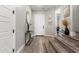 Beautiful foyer featuring hard surface floors, neutral paint and staircase at 21186 W Hillcrest Blvd, Buckeye, AZ 85396