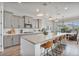 Beautiful kitchen featuring gray cabinetry, a spacious island, and stainless steel appliances at 21186 W Hillcrest Blvd, Buckeye, AZ 85396