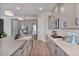 Modern kitchen featuring stainless steel appliances, a large island, and sleek countertops offering ample space at 21186 W Hillcrest Blvd, Buckeye, AZ 85396