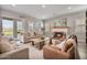 Relaxing living room featuring a fireplace, neutral colors, and comfortable seating at 21186 W Hillcrest Blvd, Buckeye, AZ 85396