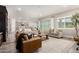Spacious living room with couches and furniture looking to kitchen and views at 21186 W Hillcrest Blvd, Buckeye, AZ 85396