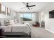 Serene main bedroom featuring a large bed, natural light, and stunning views at 21186 W Hillcrest Blvd, Buckeye, AZ 85396