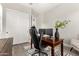 Stylish home office with wood desk, dual monitors, rolling chair, and decor at 21186 W Hillcrest Blvd, Buckeye, AZ 85396