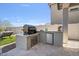 Outdoor kitchen area featuring a built-in grill, beverage cooler, and counter space at 21186 W Hillcrest Blvd, Buckeye, AZ 85396