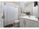 Bright bathroom featuring a white vanity, modern fixtures, and shower with decorative curtain at 22858 E Marsh Rd, Queen Creek, AZ 85142