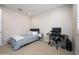 Neutral bedroom with plush carpet, single bed with soft blankets, desk, and great natural light at 22858 E Marsh Rd, Queen Creek, AZ 85142