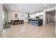 Open-concept kitchen and dining area, featuring a large island, modern appliances, and stylish lighting at 22858 E Marsh Rd, Queen Creek, AZ 85142