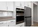 Modern kitchen featuring stainless steel appliances, including double ovens and a refrigerator at 22858 E Marsh Rd, Queen Creek, AZ 85142