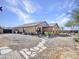 Rear view of house with patio, rock landscaping, and pathway at 23882 W Yavapi St, Buckeye, AZ 85326